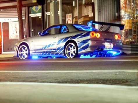 This car is a beast! Brian O'Conner's car in 2 Fast 2 Furious. Fast And Furious, At Night, Nissan, Cars, Building, Blue