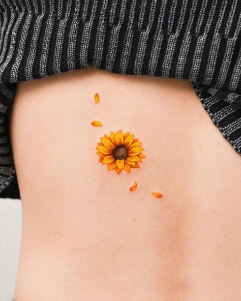 zihong | Sunflower petals around a mole🌻 💛contact : E-mail or Proflie link 📩zihongtattoo@gmail.com ✨예약문의 : 프로필링크 or 메일 | Instagram Tattoo Around Mole, Small Sunflower Tattoo Simple, Simple Cover Up Tattoos, Small Cover Up Tattoo, Mole Tattoo, Tatoos Small, Tattoo Sunflower, Sunflower Petals, Watercolour Flower