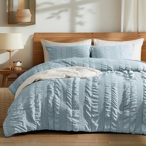 PRICES MAY VARY. Stylish Seersucker Design: PHF comforter set features a exquisite stripe seersucker design, creating a vivid three-dimensional wave pattern visual effect and making you will fall in love at first sight. The smooth brushed fabric on the back adds extra comfort. With a classic design in solid colors that blend seamlessly with any décor, this simple and fashionable set is a must-have for your bedroom. Lightweight and Softness: Indulge in luxury with PHF's premium synthetic comforte Light Blue Bedding Sets, Boho Bedding Light Blue, Bedding Sets Light Blue, Blue Twin Beds, Light Blue Comforter, Cooling Comforter, Boho Bedding Sets, Twin Size Comforter, Beachy Bedroom