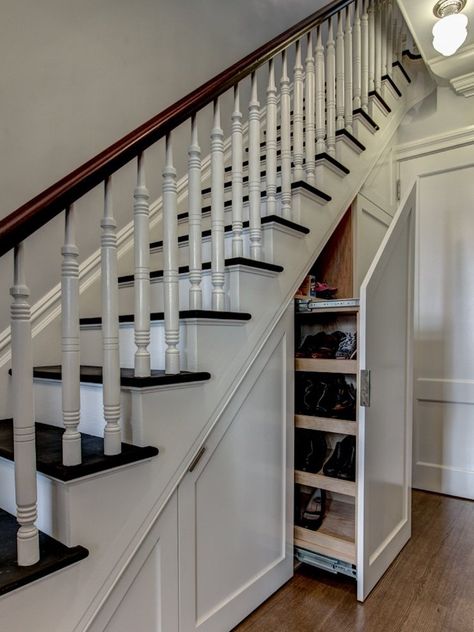 Creative solutions, ranging from sneaky storage to cozy nooks, tackle the home's trickiest triangle. Shoe Storage Under Stairs, Cabinet Under Stairs, Vertical Drawer, Kitchen Under Stairs, Shoe Storage Design, Foyer With Stairs, Shoe Storage Diy, Space Under Stairs, Under Stair