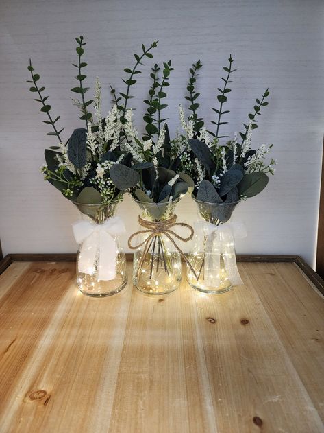 Eucalyptus Greenery Lighted Bud Vase Centerpiece Wedding - Etsy Canada Cheap Wedding Table Centerpieces Simple, Fairy Lights In Vase With Flowers, Simple Wedding Centerpieces Eucalyptus, Eucalyptus Beach Wedding, Vase Fairy Lights, Fairy Light Glass Vase Centerpiece, Olive Green Centerpieces Wedding Ideas, Eculyptus Table Centerpieces, Table Centerpieces For Baby Shower Boys