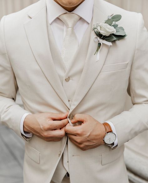 Set the tone with tone-on-tone. Layer of creamy tan, brown, white, and champagne create a look that's decadently dressed-up. Neutral Wedding Suit Groom, Light Colored Mens Suit, Sand Suits Wedding, Champagne Best Man Suit, Mens Taupe Suit Wedding, White And Champagne Groom Suit, Champagne Suits For Men Groomsmen, Wedding Suits Groom Cream, Tan Wedding Tuxedo Groom Attire