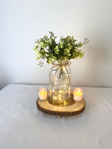 Mason Jars With Lights, Wood Centerpieces Wedding, Jar Centerpiece Wedding, Mason Jar Flower Arrangements, Mason Jar Fairy Lights, Gallon Mason Jars, Winter Wedding Centerpieces, Mason Jar Centerpiece, Lighted Centerpieces