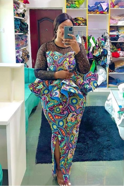 A lady wearing an Ankara skirt and blouse with slit Ankara Peplum Top Outfits, Skirt With Peplum Top, Blouse Styles For Women, Ankara Top And Skirt, Peplum Top Outfits, Ankara Skirt Styles, Ankara Skirt And Blouse Styles, Ankara Peplum Tops, Ankara Outfits