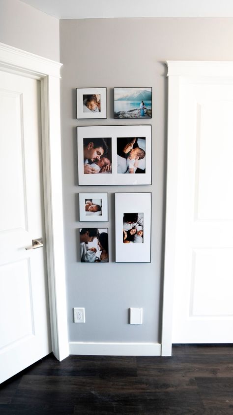 Small Wall Picture Display, Photo Wall Collage Vertical, Gallery Wall Narrow Space, Gallery Wall Ideas Vertical, Vertical Frames On Wall, Vertical Wall Gallery, Narrow Gallery Wall Layout, Minimalist Picture Frames On The Wall, How To Decorate With Pictures