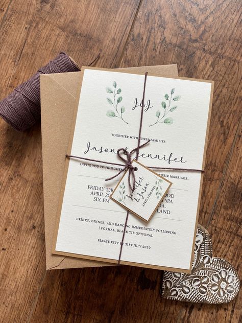 Wedding invitations with a rustic and simple design, sure to impress your guests and give them the first impression of your big day. Includes: . Personalised rustic green leaves invitation 5 in x 7 in . High quality kraft fleck envelope (Blank) . Printed on high quality linen ivory card stock . Mounted on kraft brown card . Twine with tag Matching Stationery: https://www.etsy.com/uk/listing/803393843 SAMPLES; If you would like to order a sample (non personalised) just add one to your basket and Rustic Greenery Wedding, Wedding Invitation Green, Kraft Invitation, Brown Wedding Invitations, Botanical Wedding Stationery, Leaf Invitations, Wedding Invitations Leaves, Wedding Table Names, Save The Date Karten