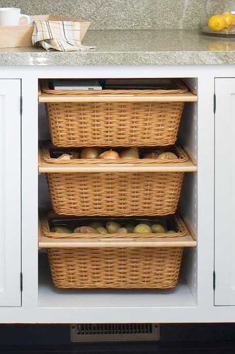 Redoing your kitchen cabinets? Consider adding a couple of slide-out baskets, which are ideal for storing vegetables that don't need to be refrigerated, such as onions and potatoes. #organization #storageideas #kitchenorganization #bhg Barndoor Hardware, Onion Storage, Island Storage, Kitchen Island Storage, Produce Storage, Kabinet Dapur, Kitchen Necessities, Diy Kitchen Storage, Kitchen Cabinet Storage