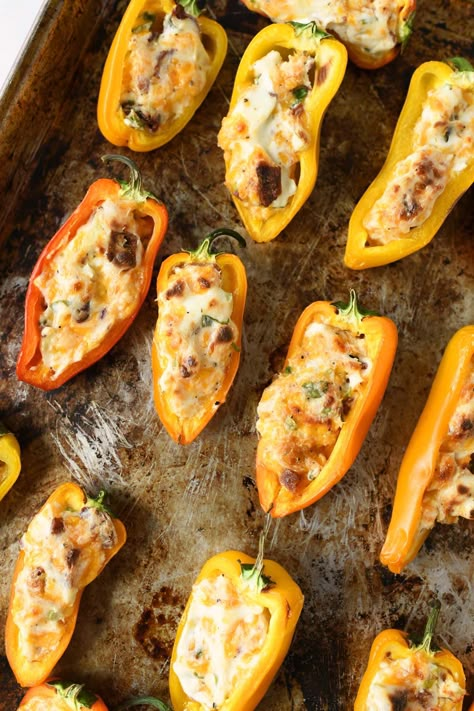 Cheesy Bacon Stuffed Mini Peppers. In this post, we'll show you how to make Cheesy Bacon Stuffed Mini Peppers. These sweet bite-sized peppers are stuffed with a scrumptious bacon cream-cheese mixture and are almost identical to a jalapeño popper. Roasted in the oven, these peppers make a delicious summer appetizer that everyone will love at first bite. Bob Evans Biscuit Recipe, Stuffed Peppers Oven, Stuffed Peppers Appetizer, Pool Party Recipes, Ideas For Pool Party, Potluck Sides, Potluck Finger Foods, Snack Wraps, Easter Candy Recipes