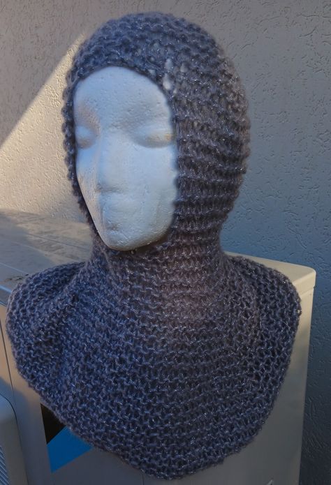 Knitted faux chain mail hood for medieval fair. Or balaclava for child to adult. Shown on a model head size 54. The neck-piece measures 24cm underneath the chin.  Hand made in Australia. Hand knit from a soft 10% Superwash Wool, 15% Mohair, 30% Acrylic, 20% Polyamide, 25% Metallic Lurex. More information on head and hat sizes is available from https://www.jasfashion.com.au/buying/buying-guides/head-n-hat-size-guide/. You can find a converter from the metric system to other systems here: https:// Knit Chainmail, Medieval Knitting, Medieval Hood, Medieval Fair, Crochet Hood, Hood Pattern, Knitted Balaclava, Head Model, Knitted Hood