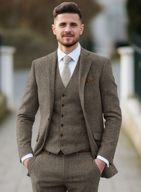 A classic design with a modern silhouette, our Tweed Suit is a must-have for every modern gentleman. Crafted from wool, the unique tweed fabric characterized by its herringbone weave structure that is famous for its warmth and durability makes this suit an ideal transitional piece for business or formal events. Combine it with a matching waistcoat, blue shirt, a patterned tie and polished brogue shoes.   Look Includes  Vintage Dark Brown Herringbone Tweed  Horn Brown Buttons  Notch Lapel   Doubl English Wedding Groom Suit, Unique Groom Outfit, Grey And Brown Wedding, Peaky Blinders Wedding Suits, Tweed Groom Suit, Groom Suit Vintage, Rustic Wedding Suit, Groom Blue Suit, Tweed Jacket Outfit