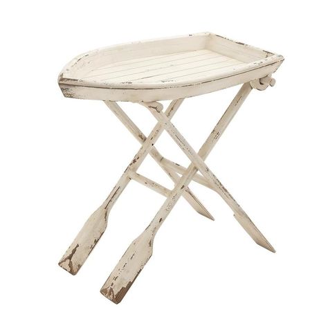 Features natural fir wood. Neutral hue works with any color palette. BOAT SHAPE: Carved wood boat top on oar-shaped base, all with a distressed white finish. SMALL WOOD TABLE: Measures 28-in L x 16-in W x 25-in H and weighs 11.60 lbs. Grayson Lane Coastal Decor Distressed White Wood Accent Table White Boat Table with Oar Legs Small Folding Table Boat and Oars Decorative Table 28” Coastal Accent Table, Boat Table, White Accent Table, Wood Folding Table, Side Table Decor, Wood Accent Table, Wood Boats, Wood Tray, Tray Table