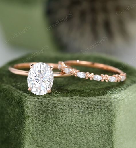 Oval moissanite Engagement Ring Set Unique Vintage Rose Gold Engagement Ring women Unique Diamond Bridal ring Anniversary gift Promise ring ITEM DESCRIPTION: Center stone: Oval cut Moissanite Size: 7*9mm Shaped: Oval shaped Side stone: 0.065ct moissanite Color/Clarity: G-H,SI1-VS Or moissanite :0.065ct 0.9mm Round cut Width of band: 1.5mm Thickness of band: 1.2mm Total weight: 2.2g Wedding band Natural Diamonds:0.18ct Stone size:a 1.5*3mm Marquise cut CLARITY: SI/VS COLOR: G/H Or moissanite 0.18 Dainty Oval Wedding Ring Set, Rings Engagement Moissanite, Rose Gold Oval Wedding Ring Set, Engagement Rings Solitaire Oval, Oval Moissanite Engagement Ring Set, Oval Dainty Engagement Ring, Mossianite Engagement Rings Oval, Unique Mossianite Engagement Rings, Oval Shaped Wedding Rings