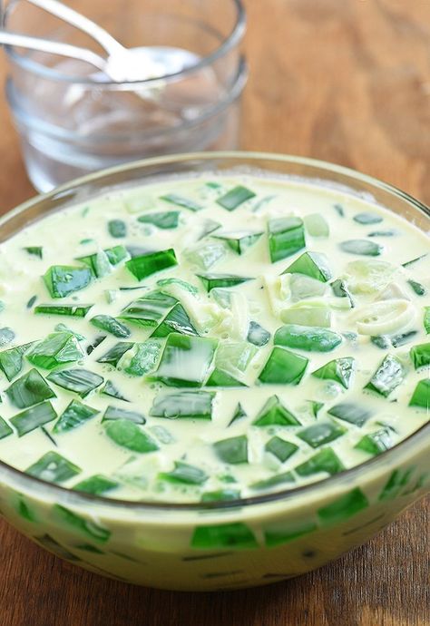 buko pandan salad is a Filipino dessert made with gelatin cubes, tropical palm fruits, tapioca pearls, young coconut in a pandan-infused cream Buko Pandan Salad, Pandan Recipe, Buko Pandan Recipe, Buko Salad, Buko Pandan, Pinoy Dessert, Filipino Food Dessert, Dessert Aux Fruits, Filipino Desserts