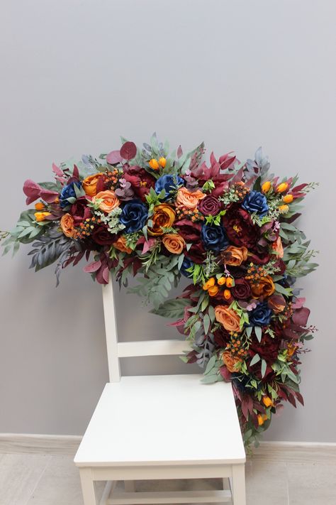 The fall wedding flower arch is adorned with a captivating blend of burnt orange, navy, and burgundy flowers, creating a warm and inviting display that perfectly complements the season. The wedding arch swag, featuring these rich and autumnal colors, adds a touch of elegance and rustic charm to the ceremony setting. ○ Color: deep blue, orange, burgundy, sage green ○ Personalization: I can make changes to your wishes ○ Processing time: 1 - 2 weeks ○ Shipping time: 7 - 14 business days NOTE  ○ I s Navy Blue Burgundy And Burnt Orange Wedding, Burnt Orange Winter Wedding, Fall Theme Wedding Decorations, Burgundy And Burnt Orange Wedding, Wedding Arch Swag, Trendy Wedding Colors, Flower Arch Wedding, Fall Wedding Tablescapes, Wedding Flower Arch