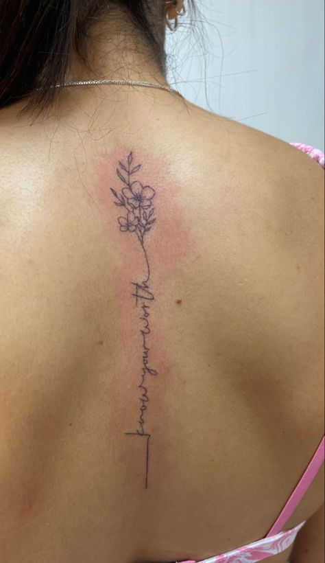 Spine Tattoos For Women With Words, Flower Script Spine Tattoo, Bible Verse Spin Tattoo, Cursive Tattoo With Flower, Know Your Worth Spine Tattoo, Small Spine Tattoos For Women Flowers, Simple Spine Flower Tattoo, Word And Flower Spine Tattoo, Find Someone Who Grows Flowers Spine Tattoo