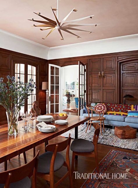 A brass star light fixture illuminates a long wood table surrounded by Danish midcentury-modern chairs in the wood-paneled dining room.. Antique rugs brighten the area. - Photo: Dominique Vorillon / Design: Jennifer Culp Wood Paneled Dining Room, Paneled Dining Room, Long Wood Table, Pink Dining Room, Star Light Fixture, Georgian Style Homes, California Colors, John Robshaw, Classic Interior Design