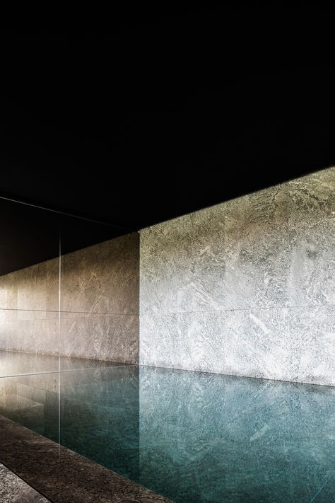 This mesmerizing pool inside a private spa by Britsom & Philips in Gent, Belgium, features a wall and basin made of Muschelkalk marble from Germany. Swimming Pool Wall Design, Architecture Visualization Photoshop, Marble Pool, Underground Pool, Inside Pool, Marble Mirror, Marble Tub, Pool Indoor, Indoor Pool Design