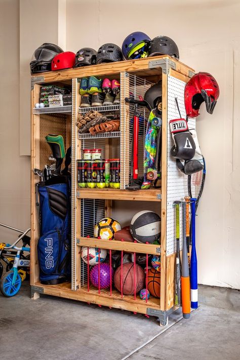 Tired of organizing and taking out sports equipment for weekly practice. Storing sports equipment can feel a bit overwhelming, but luckily we have the perfect solution to keep all your equipment in one place. Our DIY Sports Equipment Organizer provides ample storage with separate compartments and shelves to keep everything neatly organized. Build it today following our guided step-by-step free downloadable plan on our blog Sports Equipment Organization, Connecticut House, Garage Hacks, Sports Equipment Storage, Casa Garage, Garage Storage Inspiration, Gear Room, Sports Storage, Garage Organisation