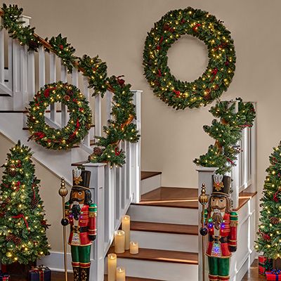 How to Make a Holiday Wreath - The Home Depot Indoor Staircase, Tree Collar Christmas, Porch Trees, Cheap Lite By Battery Xmas Wreaths 36”, Christmas Staircase Decor, Kids Budget, Solar Christmas Lights, Decor Checklist, Christmas Tree Storage