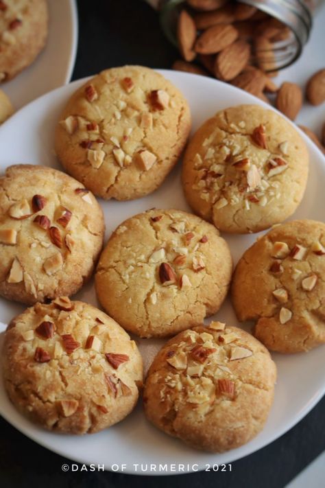 These Eggless Almond Cookies are rich, buttery, crisp from the outside, and soft and melt in your mouth from inside. Kids or adults, everyone loves to munch on these cookies. It is simple, quick and easy to make, melt in mouth cookies. It is made from almond flour or almond meal, all-purpose flour (maida), sugar and ghee. #dashofturmeric #almond_cookies#almond #cookies #winter Almond Tart Recipe, Almond Flour Recipes Cookies, Cookies Eggless, Chinese Almond Cookies, Eggless Cookie Recipes, Eggless Cookies, Almond Biscuits, Cheesecake Bites Recipe, Almond Meal Cookies