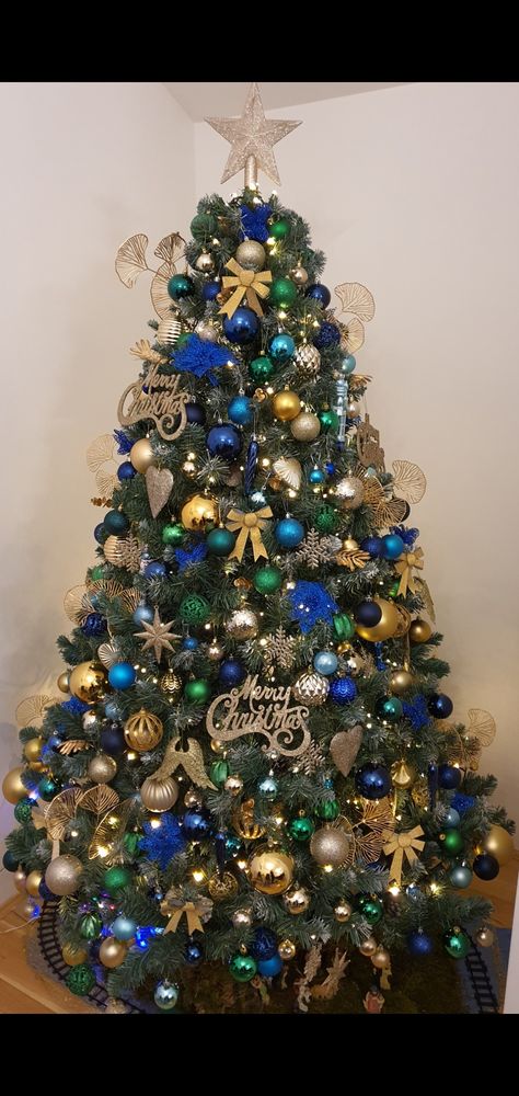 Navy Gold Green Christmas Tree, Green Blue Gold Christmas Tree, Blue Green Gold Christmas Decor, Blue Gold And Green Christmas Tree, Blue Green And Gold Christmas Decor, Blue Green And Gold Christmas Tree, Blue And Green Christmas Tree Decor, Blue And Green Christmas Tree Ideas, Peacock Theme Christmas Tree