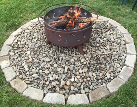 Fire pit on river rocks with paver boarder Paver Boarder, Build A Fire Pit, Diy River Rock, Paver Fire Pit, Fire Pit With Rocks, How To Build A Fire Pit, To Build A Fire, Fire Pit Materials, River Rock Landscaping