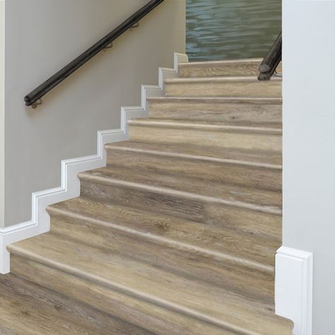 Cap-A-Tread stair renewal system combines elegance with ease of installation, allowing any customer to update or refresh stairs. Cap-A-Tread is a patented stair renewal system that requires no alteration of the stairs, uses a pre-attached, durable stair nosing and can be installed on closed stairs or stairs with an open sided profile. Easy glue down installation and expert guidance gives you a cost-effective way to add significant value and beauty to your home. Cap-A-Tread comes with a 20-year w Stair Side Trim, Stair Molding Trim, Closed Stairs, Painted Wood Stairs, Vinyl Stair Risers, Vinyl Stair Treads, Diy Stairs Makeover, Stairs Trim, Laminate Stairs