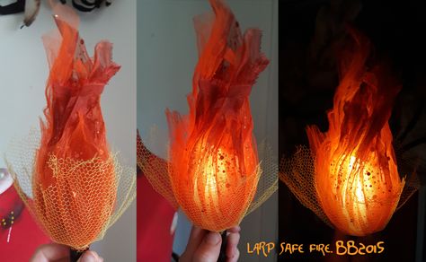 Burn, baby, burn.  Magpie Bones brings us this nifty LARP safe fire effect .  The flames are shaped organza or tulle around an LED core. It'... Sorceress Cosplay, Fake Fire, Scifi Horror, Horror Design, Anniversaire Harry Potter, Bijoux Fil Aluminium, Zucca Halloween, Cosplay Tutorial, Seni Origami