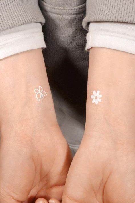 25 Attractive White Tattoo Designs – Ideasdonuts Small White Tattoos, White Butterfly Tattoo, Earthy Tattoos, Tato Minimal, Tato Jari, Pola Tato, White Ink Tattoo, Petite Tattoos, Парные Тату