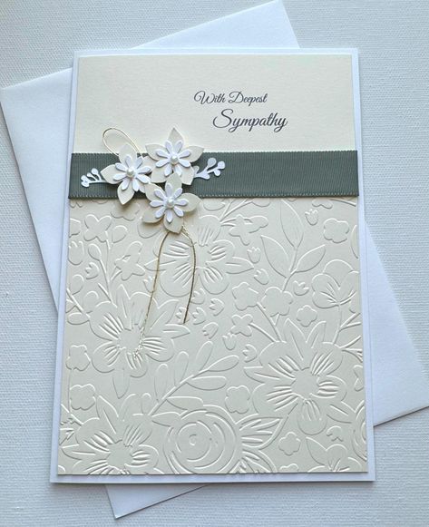 This card features embossed flowers, green grosgrain ribbon and three layered flowers with pearl centers. A gold thread adds to the beauty of this card. With deepest Sympathy is printed on the top. Card measures 5x 7 inches on 80# white card stock with matching envelope. Inside message: May the prayers of those who love you carry you through this time of sorrow. Changing lives...one card at a time!   100% of the money from the sale of this card is donated to charity M.O.R.E. which supports programs for orphaned and vulnerable children in Addis Ababa, Ethiopia. For additional information, visit www.morechildren.org.  @morechildren.  @cardsformore Embossed Cards Handmade, With Deepest Sympathy, Stampin Up Sympathy Cards, Card With Flowers, Sympathy Cards Handmade, Deepest Sympathy, Wedding Cards Handmade, Embossed Cards, Sympathy Card