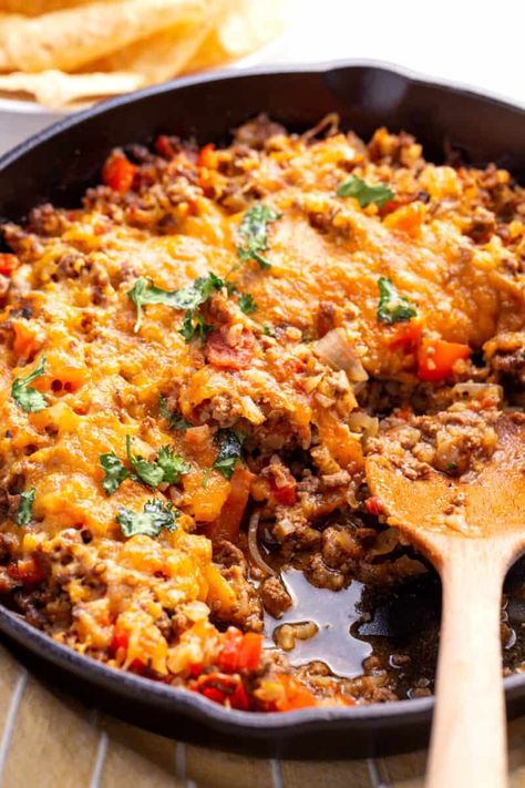 This amazing Mexican cauliflower rice is full of tasty seasonings, hearty ground beef, and lots of healthy veggies. It is the perfect one-pot dinner that you can feel good about eating.  This cauliflower rice recipe is going to completely transform Mexican night in your house. It is healthier than regular rice bowls and also easier… The post Loaded Mexican Cauliflower Rice appeared first on All Things Mamma. Taco Cauliflower Rice Skillet, Low Carb Burrito Bowl Cauliflower Rice, Riced Cauliflower Taco Bowl, Keto Mexican Riced Cauliflower, Taco Bowl With Cauliflower Rice, Riced Cauliflower Spanish Rice, Ground Beef Cauliflower Rice Recipes, Recipes With Riced Cauliflower Low Carb, Burrito Bowl With Cauliflower Rice