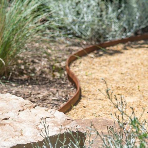 John Leathart on Instagram: "A blending of textures - a meshing of materials. Constructing this @spherelandscapedesign garden took us to our happy place using @adelaidehillssandstone stone, @eghollard Corten steel edging and recycled red bricks. @longshotimages capturing the details with her usual style!" Garden Corten Steel, Corten Steel Edging Landscape, Steel Garden Edging Ideas, Steel Edge Landscape, Corten Edging Garden, Recycled Brick Garden Edging, Garden Path Edging, Corten Steel Garden Edging, Metal Edging Landscape