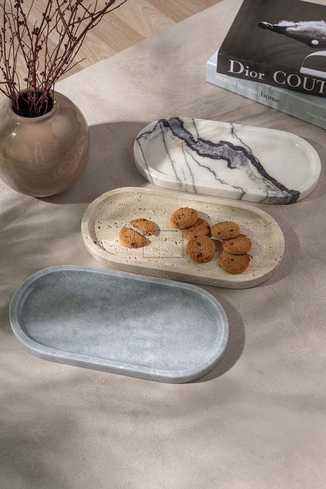 Elegant Aegean Marble Platter Set (3-Piece) Transform your dining experience with our elegant Aegean marble platter set of 3 Pieces. Handcrafted from premium Aegean marble sourced from Turkey--the same marble celebrated for its use in ancient Roman architecture--this set combines timeless sophistication with versatile functionality. Each platter features solid marble construction, ensuring durability and a luxurious appearance. The smooth surfaces are ideal for serving a variety of foods, from a Marble Objects, Street Room, Stone Tray, Ancient Roman Architecture, Marble Serving Trays, Marble Accessories, Marble Furniture, Platter Set, Kitchen Vanity