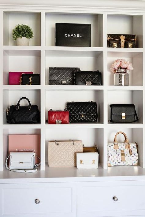 In a small closet alcove, designer bags sits in built in purse shelves positioned above white drawers donning polished nickel knobs. Purse Display, Handbag Display, Bag Closet, Walking Closet, Purse Storage, Handbag Storage, Closet Decor, Dream Closets, Small Closet