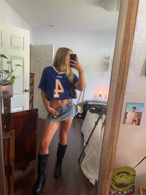 Bills jersey denim skirt leather boots Jersey And Denim Skirt Outfit, Jersey And Cowboy Boots Outfit, Cool Gameday Outfits, Jersey And Mini Skirt Outfit, Football Jersey And Skirt Outfit, Leather Festival Outfit, Blue Jean Mini Skirt Outfit, Denim Skirt Festival Outfit, Uf Game Day Outfit