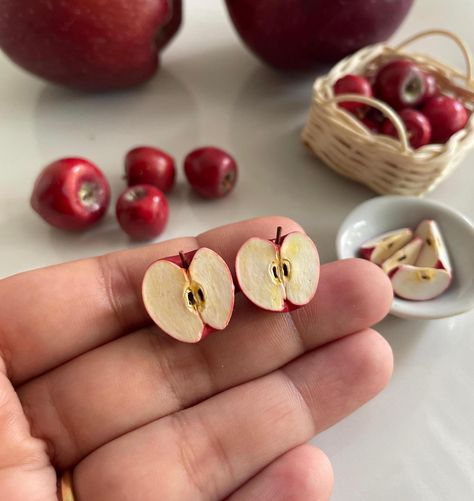 These Apple Studs are perfect for those who loves Apple ! This is a 100% hand-made realistic fake food miniature. Now you can have your favourite fruits as a Miniature earrings. "Hello Miniverse" creates uniquely handmade fruits inspired Fruits Earrings that look as delicious as the real thing.  I make sure packaging is high quality to sustain rough handling by courier service during transit. Dispatch time: Within 15 days.  Delivery time:  Domestic: 5-6 Days International: 20-25 days. Care: Please treat the Apple Studs with care. Remove dust with a piece of soft fabric, a brush or a sponge. Protect the product from damages. Do not drop. If you have any question about this listing or anything else, please feel free to contact me. I will get to you as soon as i can! Thanks for viewing this l Fruit Accessories, Miniature Earrings, Apple Clothes, Polymer Clay Accessories, Apple Bag, Clay Fruit, Apple Earrings, Miniature Food Jewelry, Quirky Jewelry