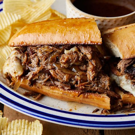 Slow Cooker French Dip Sandwiches feature tender beef cooked in a savory blend of beef broth, red wine, worcestershire, and herbs. Served on toasted rolls with melted cheese, these sandwiches are to die for. The slow cooking process ensures the beef is falling apart and creates a rich au jus sauce as the roast cooks. Au Jus Sauce, Slow Cooker French Dip Sandwiches, Jus Sauce, French Dip Sandwich Crockpot, Roast Beef Crock Pot Recipes, Slow Cooker French Dip, French Dip Crock Pot, Hamburger Helper Recipes, French Dip Sandwiches