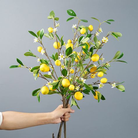 PRICES MAY VARY. Perfect Size --- The length per artificial lemon branch is 27inch/70cm, and the diameter per lemon approx 1.37 inches, and stems are easy to cut and form around a structure if needed. Comes with lifelike artificial lemons in a nice green leaf. Always Fresh --- Fake fruit lemon decor will stay vibrant and fresh for years, its an ideal table centerpiece, and equally impressive on a sofa table or dining room table. Please don’t place lemon decorations for kitchen in outdoor areas, Rustic Floral Decor, Lemon Table Decor, Floor Vase Fillers, Fake Lemons, Summer Room Decor, Vase With Branches, Farmhouse Table Centerpieces, Farmhouse Vase, Artificial Branches