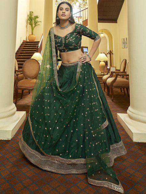 "Dress elegantly adorning this green color lehenga in art silk material embellished with floral zari, sequins, and lace embroidery work comes with attached can-can inside. Paired with green color embroidered art silk and green lace worked net dupatta. This lehenga is semi-stitched can be customized up to 42 inches comes with fully unstitched choli material. Every girl transforms into a gleaming diva throughout the wedding season! Royal embroidered lehenga, dazzling jewelry, and beautiful make-up Green Color Lehenga, Dark Green Lehenga, Plain Lehenga, Lehenga Green, Mirror Work Blouse, Net Blouses, Green Lehenga, Net Lehenga, Embroidered Lehenga