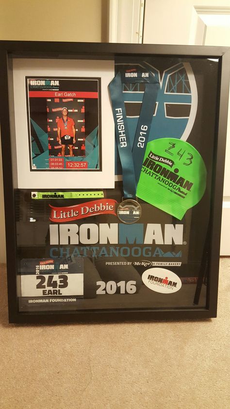 Ironman shadow box was homemade for my husband. Shadowbox from Hobby Lobby ($50 after coupon). Display your ironman, marathon or triathlon race medal, swim cap, race bib and other memorabilia. Simple, easy and way cheaper than having it professionally done. All you need is hot glue gun and a few pins and a vision. Make sure to keep lots of things from race day. Ironman Chattanooga 2016 Race Bib Display, Race Medal Holder, Race Medal Displays, Marathon Medal Display, Triathlon Motivation, Race Medal, Running Medals, Race Bibs, Award Display