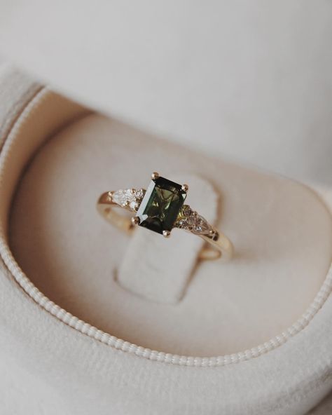 Congratulations Quin + Rae 🥹💍🍾 We customized our Elsie setting, switching out the centre stone for a stunning 6x4mm natural dark green tourmaline with pear and round accents. We wish you the best for your engagement season!! Engagement photos by the lovely: @jordanfayephotography Dark Emerald Engagement Ring, Dark Green Engagement Ring, Olive Branch Jewelry, Green Wedding Rings, Green Engagement Rings, Old New Borrowed Blue, Engagement Season, Beautiful Baubles, Ring Inspo