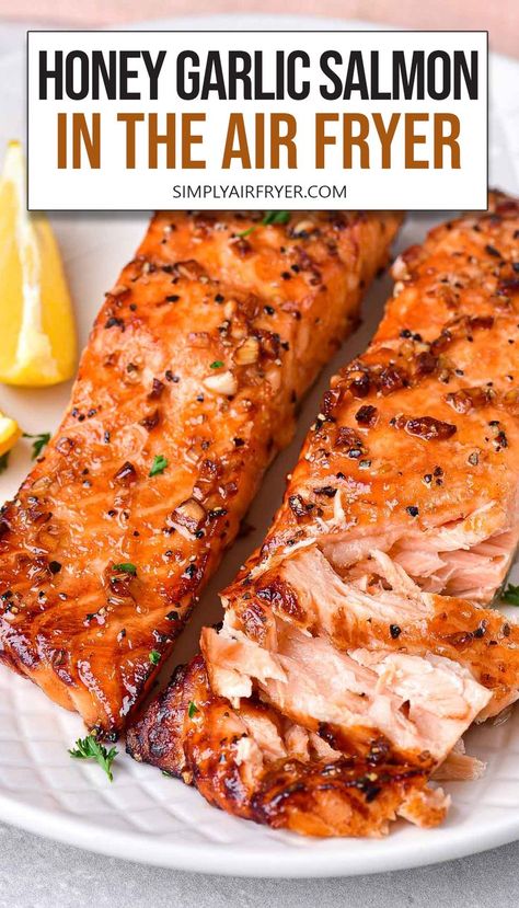 cooked honey garlic salmon fillets on white plate with text overlay "honey garlic salmon in the air fryer". Easter Entrees, Air Fryer Recipes Salmon, Salmon Recipes Baked Healthy, Air Fryer Salmon, Honey Garlic Salmon, Air Fryer Fish, Garlic Salmon, Air Fryer Oven Recipes, Easy Salmon Recipes