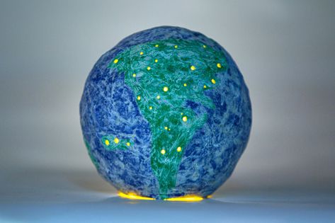 Papier-Mache Globe - The New York Times Giant Candles, 51st Anniversary, Candle Images, Blue Tissue Paper, Tea Candle, Easy Activities, Tea Candles, Globe Lights, The Balloon