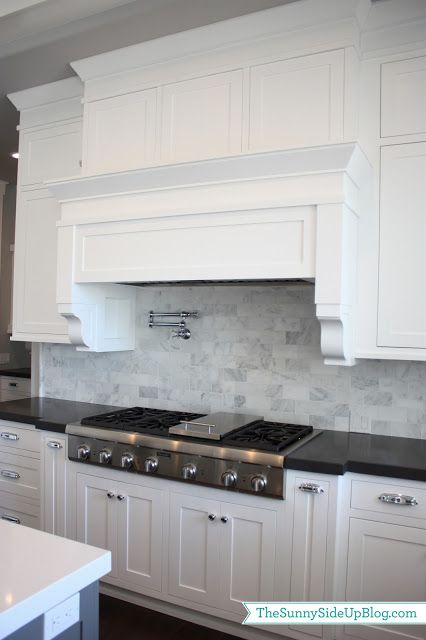 Sunny Side Up: My new kitchen!  white cabinets, black countertop, carrera marble backsplash Carrera Marble Backsplash, Architecture Renovation, Farmhouse Backsplash, Black Countertops, Herringbone Backsplash, Carrera Marble, Marble Backsplash, Kitchen Marble, Kitchen Redo