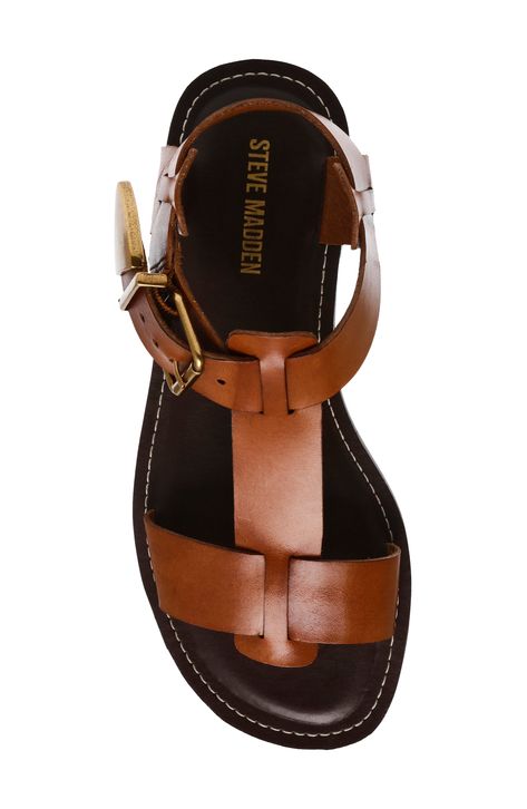 Smooth leather straps underscore the minimalist look of this modernized gladiator sandal. Adjustable ankle strap with buckle closure; hidden elastic inset Leather upper/synthetic lining and sole Imported