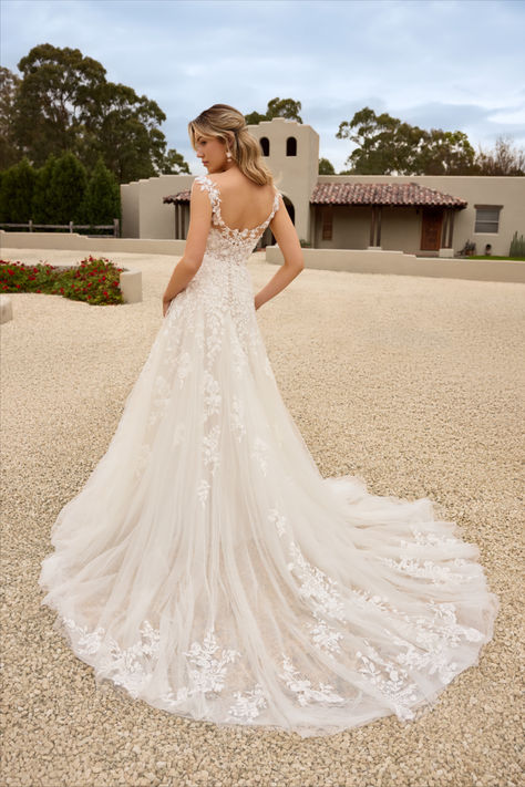 Twirl into your happily ever after with our gorgeous, bohemian gown. Kirabella is an enchanting A-line wedding dress that is guaranteed to be the talk of your wedding. The semi-sheer bodice features a plunging V-neckline and is adorned with thoughtfully placed beaded floral lace appliqués. The floral lace trickles down the bodice and flows onto the lightweight skirt. The illusion lace straps draw your eyes to the semi illusion lace back, making the back of this dress drop dead gorgeous. Lace Flowing Wedding Dress, Sophia Tolli Wedding Dresses, Bohemian Gown, Wedding Dressses, Sophia Tolli, Lightweight Skirt, Spring Wedding Dress, A Line Wedding Dress, Bohemian Wedding Dresses