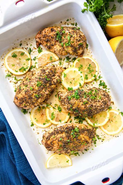 Baked chicken breasts in a pan seasoned with lemon pepper and chopped fresh parsley, surrounded by sliced lemon Lemon Pepper Chicken Breast, Baked Lemon Pepper Chicken, Pepper Chicken Recipe, Summer Chicken Recipes, Recipes With Chicken And Peppers, Lemon Pepper Chicken, Side Dish Recipes Easy, Pepper Chicken, Chicken Stuffed Peppers