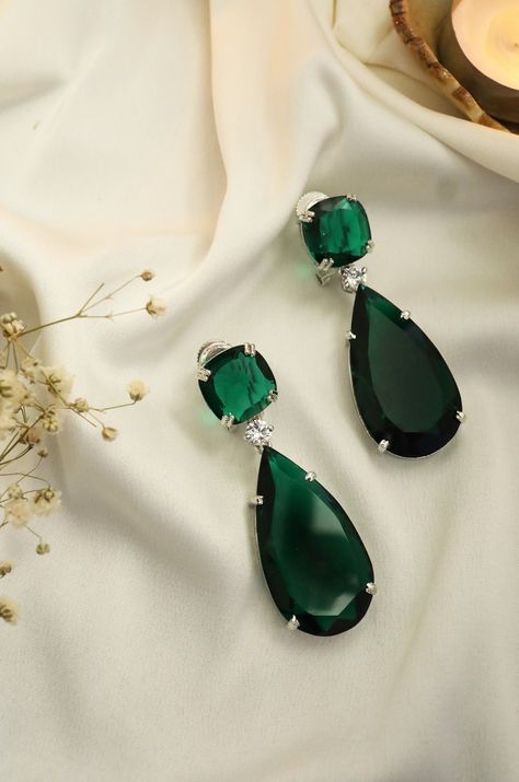 Beautiful Emerald danglers with a curated tear-drop design to be your perfect mate for the evening. Add this head-turning pair of emerald earrings to your jewelry wardrobe and make an elegant style statement. Sparkle with the fashionable emerald drop danglers. The earlobe is a graceful piece of contemporary jewelry and Bollywood jewelry. An impeccable Indian fashion cocktail jewelry dangler to embellish your look. Green Statement Earrings, Small Joys, Emerald Green Stone, Emerald Green Earrings, Earrings Emerald, Green Accessories, Cocktail Jewelry, Green Stones, Bollywood Jewelry