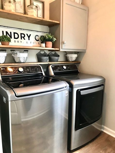 I finally designed my laundry room, it only took 8 years 😆 our dryer was acting up a bit, come to find out after the fact that the duct was clogged! Oh well, I got a new, well deserved (if I say so myself) washer & dryer.   Let’s see... first things first...clear everything out, clean, prep walls, choose paint color, plan and measure where you want everything to go.   I actually had the board and hooks before so that was nice! We bought the board from Home Depot, attached it with a nai… Dark Grey Washer And Dryer Laundry Room, Laundry Room Grey Washer And Dryer, Dark Gray Washer And Dryer Laundry Room, Charcoal Washer And Dryer Laundry Rooms, Magnolia Laundry Room, Laundry Room With Gray Washer And Dryer, Painting Laundry Room Walls, Top Loading Laundry Room, Laundry Room Wall Colors