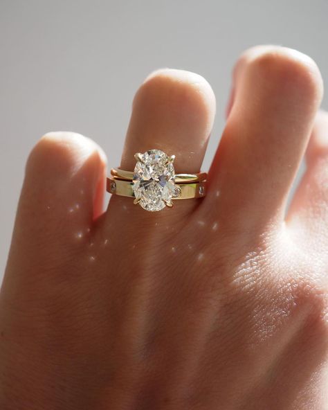 Kate & Kole | The perfect pairing — Our Clara 3.09ct Oval Solitaire Engagement Ring paired perfectly alongside our newest addition to our Wedding Band… | Instagram Thick Wedding Bands, Gold Band Engagement Rings, Thick Gold Band, Oval Solitaire Engagement Ring, Celestial Ring, Cute Engagement Rings, Oval Engagement, Dream Engagement, Dream Engagement Rings